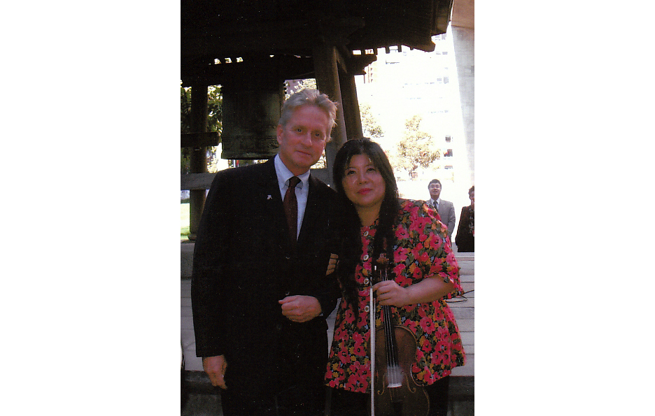Mrs. Tarumi with Michael Douglas at the Peace Bell ceremony